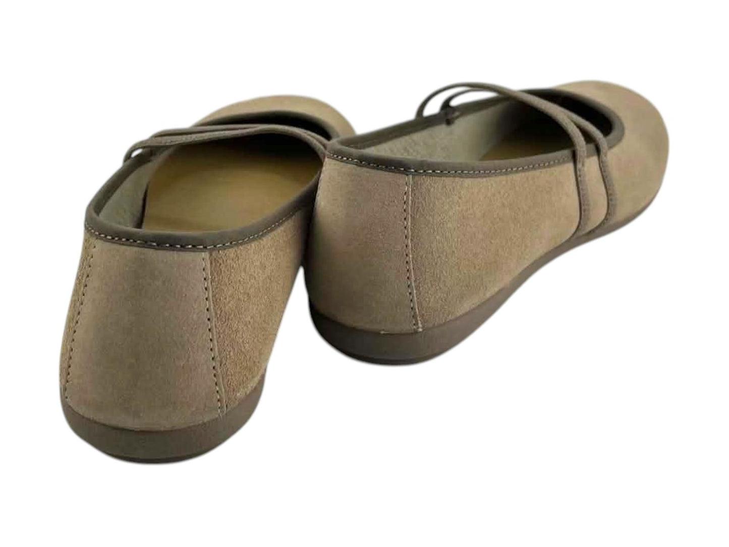 Vista por la parte de atrás de unas manoletinas bicolor para mujer en cuero beige.