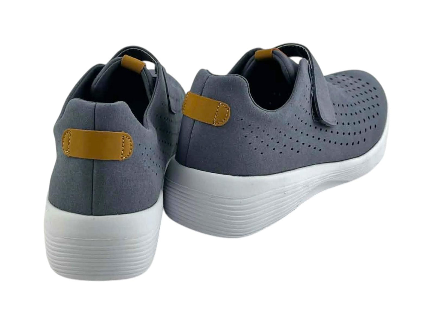 Vista posterior de zapatillas confort de mujer con detalle de tirador color mostaza y suela amortiguada de perfil deportivo.