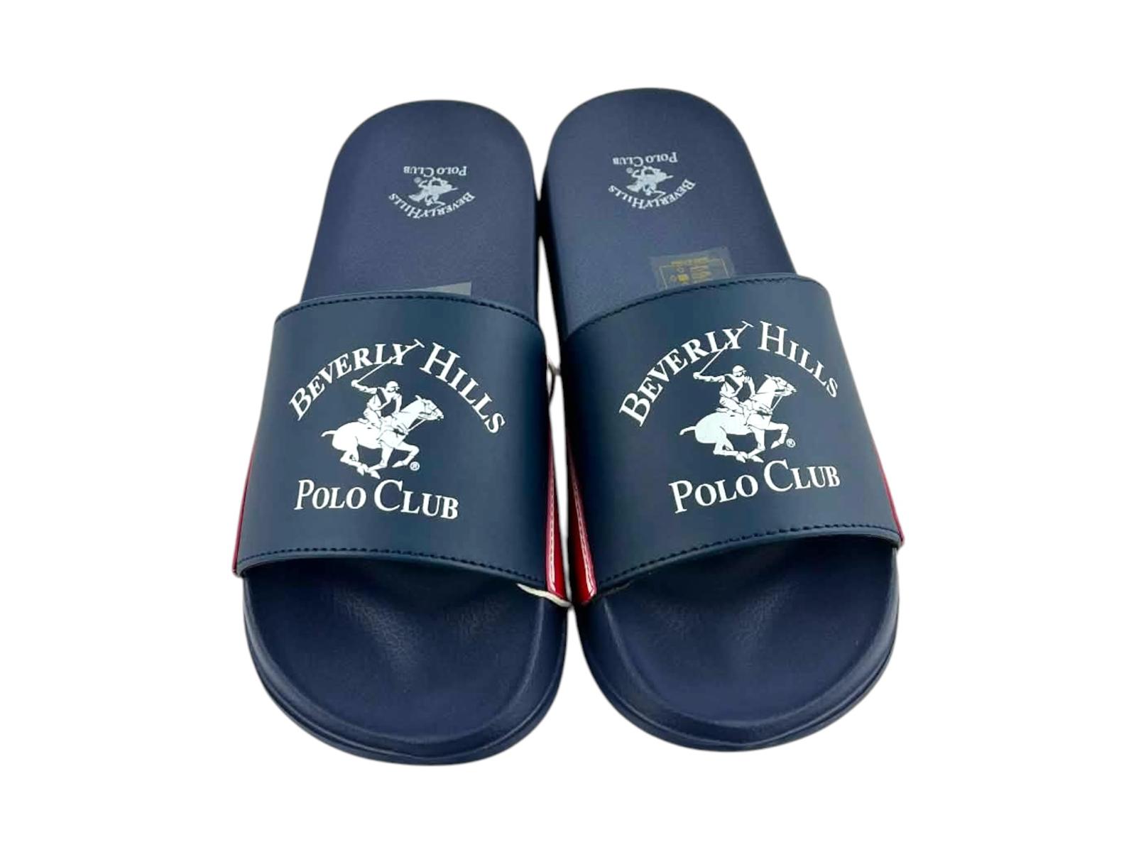 Vista superior de sandalias de playa con planta anatómica navy y el icónico escudo de polo impreso en la banda frontal.